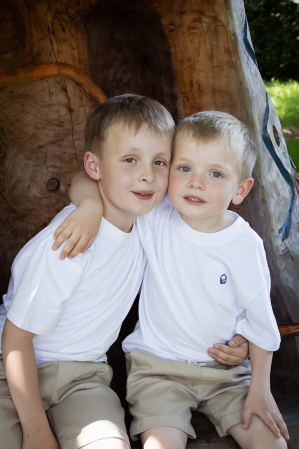 Two brothers beside an old tree