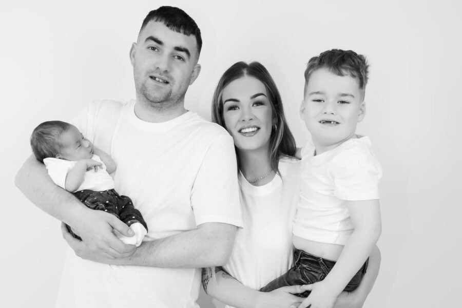 New parents with their baby and their son