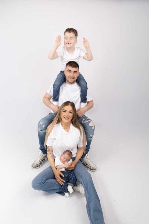 A family stacked together in the studio