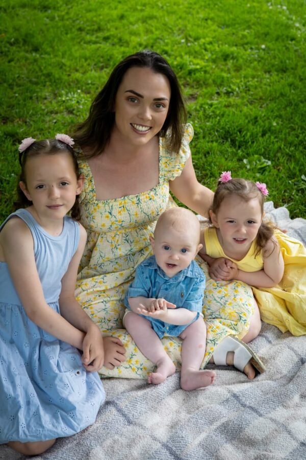 A mother with her three children in the park