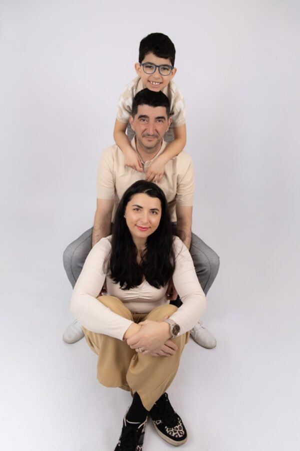 A family stacked together in the studio