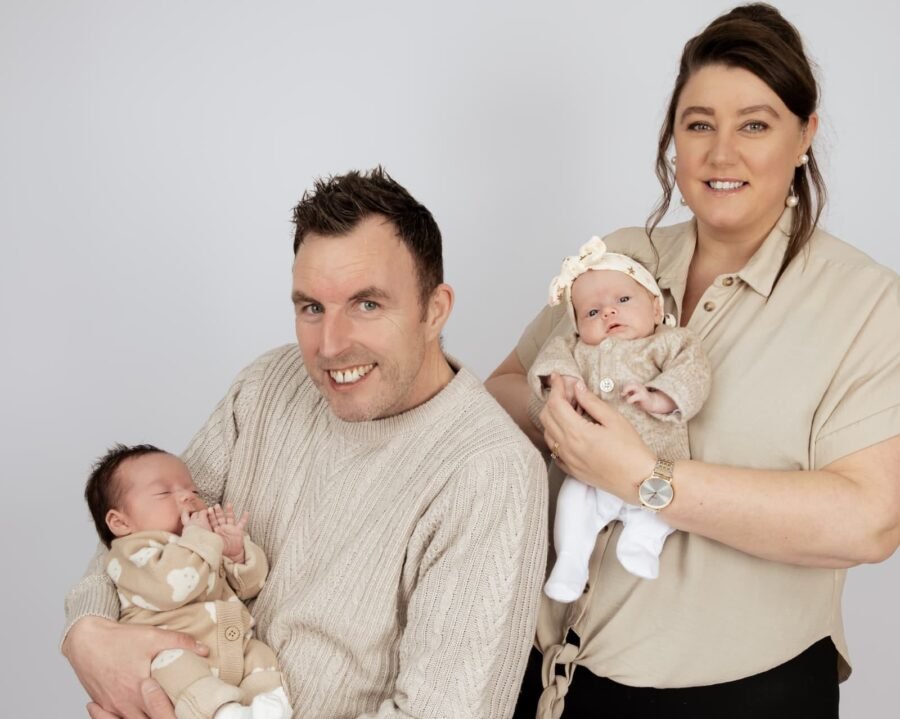 A family of four with their newborn