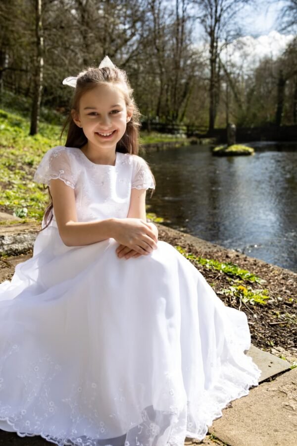 A Communion girl by the water