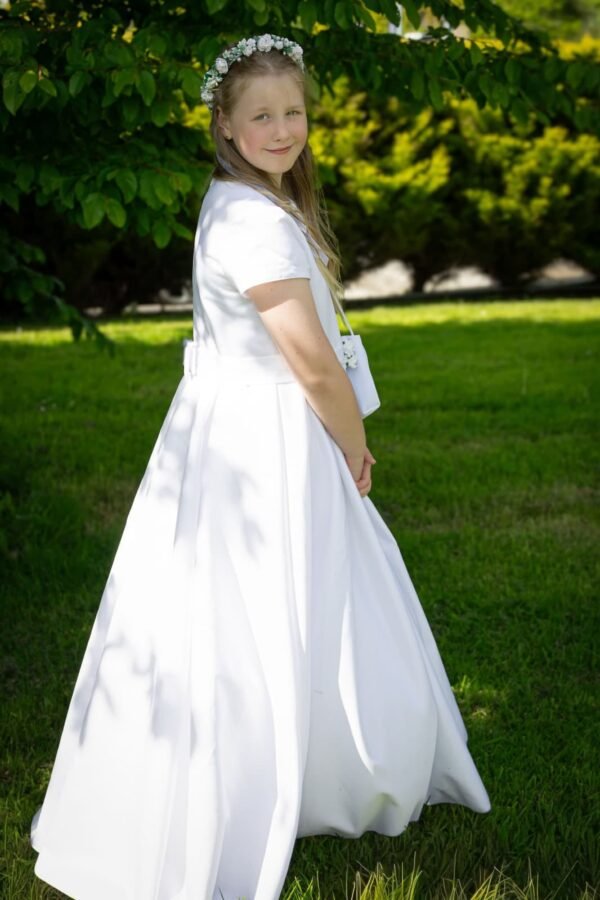 A First Communion girl in the park